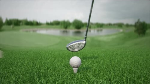 Hitting a Golf Ball with a Club on the Field Front View in Slow Motion