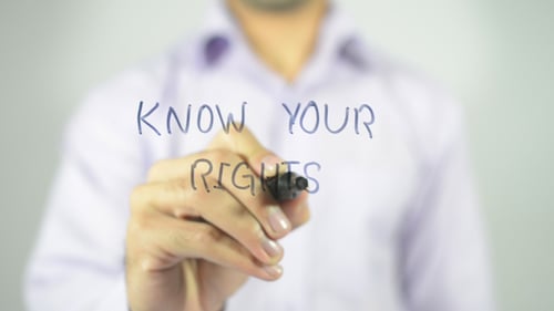 Person Writes Know Your Rights With Blue Marker