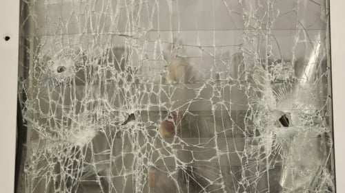Holes From Shrapnel In Window