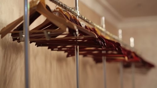 Empty Closet with Empty Wooden Hangers