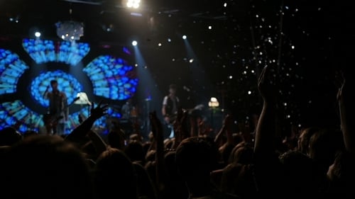 Large Crowd Enjoys Exciting Concert at Night