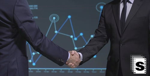 Businessmen Handshake in Front of Graph