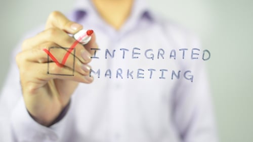 Integrated Marketing Check Mark on Clear Surface