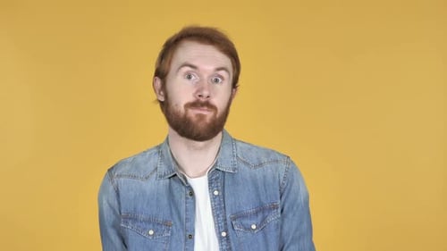 Man Dancing in Denim Shirt on Yellow Background