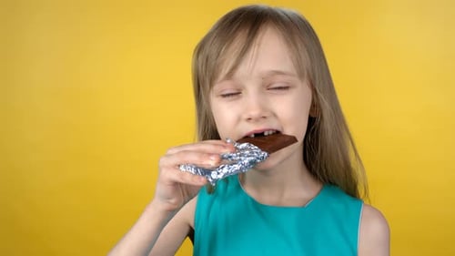 Cute Little Girl Eating Chocolate