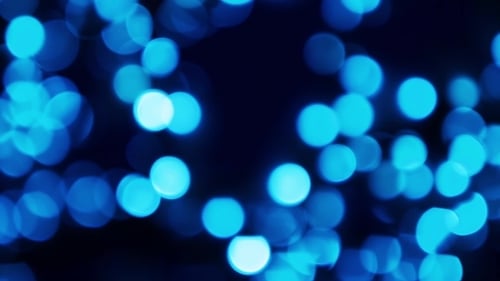 Abstract Blue Glowing Bokeh Lights Overlay Background