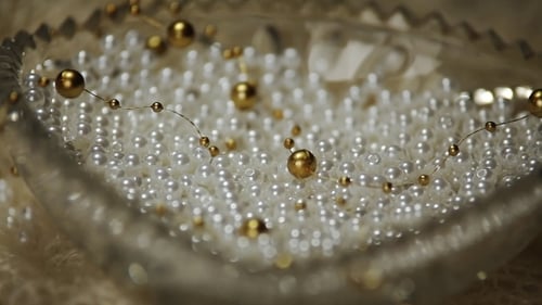 Close Up of White Pearls and Gold Orbs