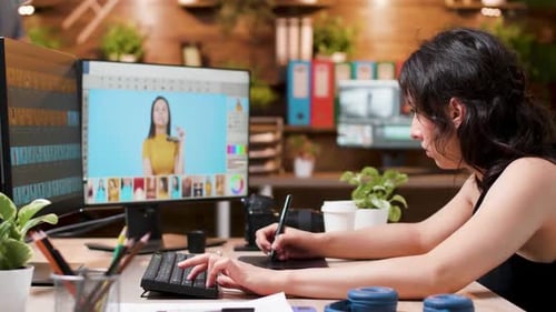 Woman Using Graphics Tablet in Modern Office