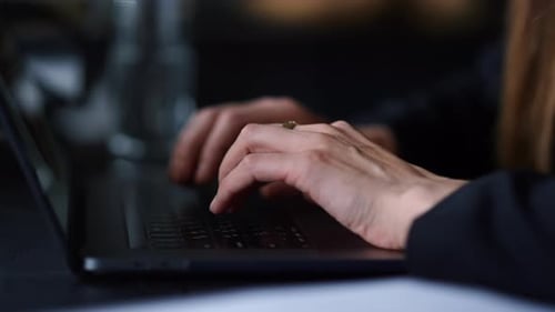 Woman's Hands Typing on Laptop Keyboard Close Up