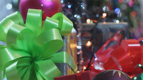 Colorful Presents and Ornaments Under Christmas Tree