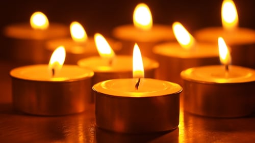 Burning Tea Light Candles Provide Warmth and Peace