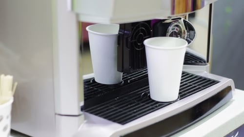 Coffee and Water Poured by Automatic Machine