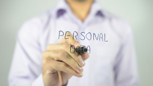 Hand Writing 'Personal Data' on Clear Surface