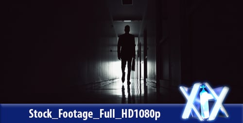 Figure Walking in Dim Hallway at Night