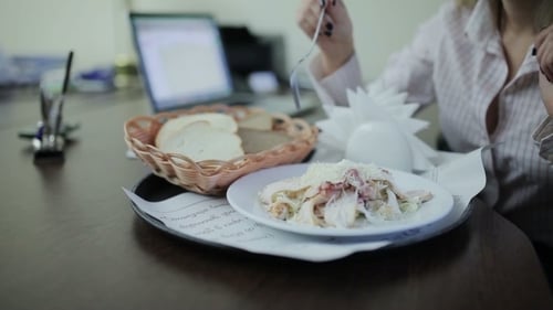 Businesswoman Having Lunch At The Office