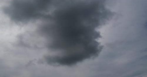 Billowing Clouds Drifting Across a Gray Sky