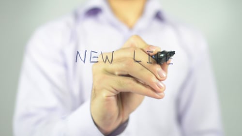 Writing the Words New Life with Marker