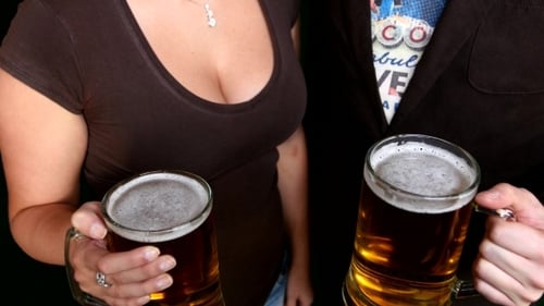 Two Friends Cheer Beer In Bar