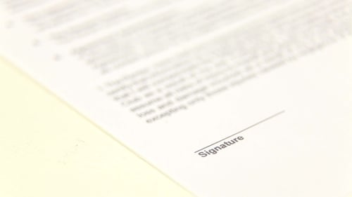 Businessman Sign a Document
