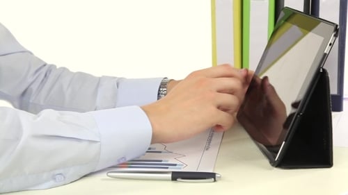 Using Tablet at Desk with Chart