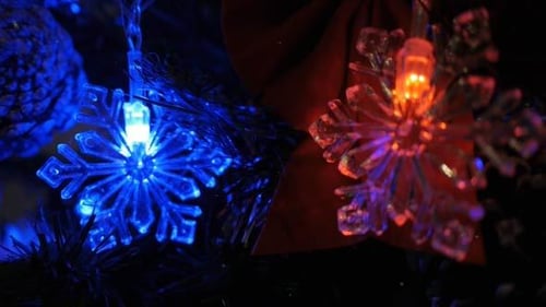 Colorful Snowflake Christmas Lights on Decorated Tree