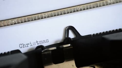 Close Up of Typewriter Typing Christmas Time
