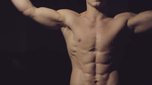 Schöner Körper eines jungen Mannes. Typ: Beugt Arme, Torso.