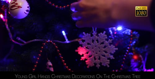 Decorating Christmas Tree with Snowflake Ornament
