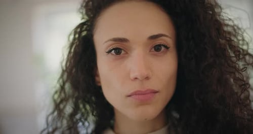 Close Up of Young Woman Looking at Camera