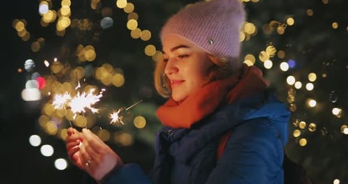 Christmas Holiday Woman Play with Sparklers
