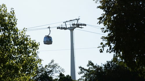 Cable Car on Overhead Cables through Trees