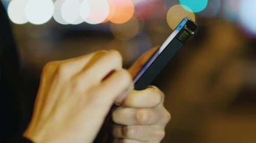 Close Up of Hands Using Phone at Night
