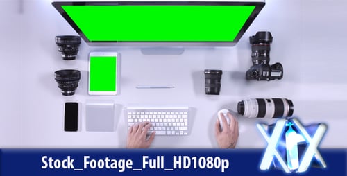 Top View of Tech Workspace with Green Screens