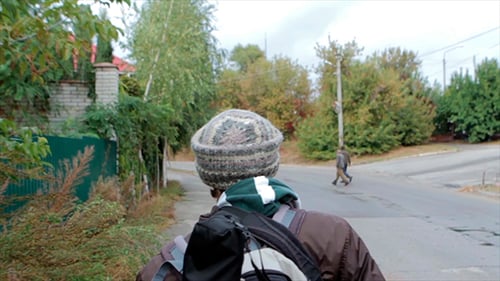 Man Walking the Street