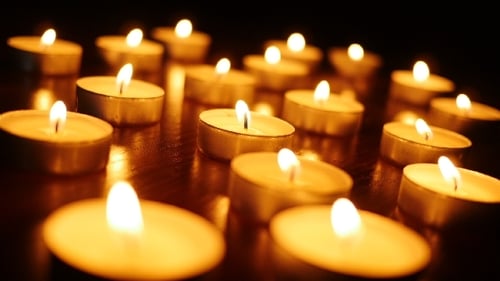 Small Candles Flickering Warmly in the Dark