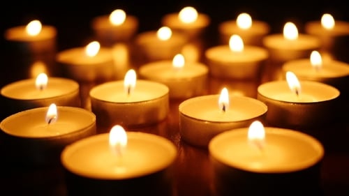 Flickering Candles Illuminate the Dark