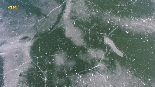 Cracked Ice Sheet Over Body of Water