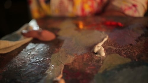 Artist Prepares Colorful Paints on Palette Close Up