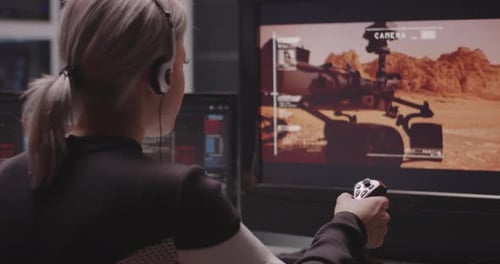 Woman Controls Mars Rover in Futuristic Workspace