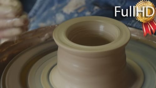 Potter Craftsman is Teaching a Woman