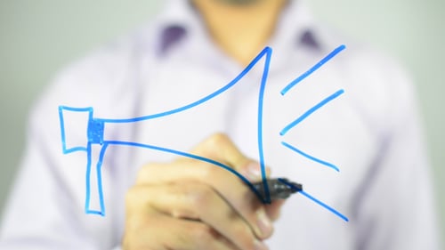 Man Draws Blue Megaphone on Transparent Surface