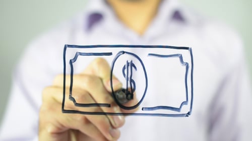 Hand Draws Dollar Bill with Black Marker