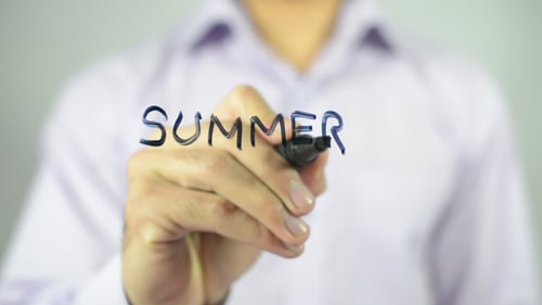 Man Writes the Word 'Summer' on Glass