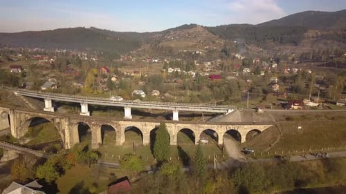 Aerial view of an old ruined train bridge in town of Vorokhta in Carpathian mountains, Ukraine.