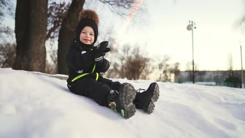 Child Waving in Snowy Winter Scene