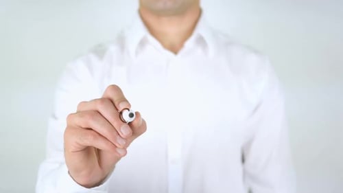 Man Writing Copyright on Clear Surface