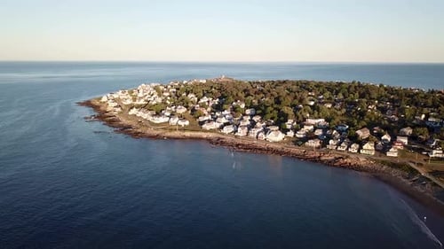 Aerial drone video of the ocean coastline and homes at Short Sands Beach near Cape Neddick and York,