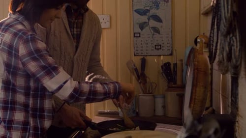 Couple Cooking Together in Cozy Home Kitchen