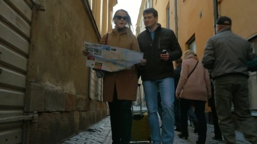 Couple Walking Down Narrow Street with Map