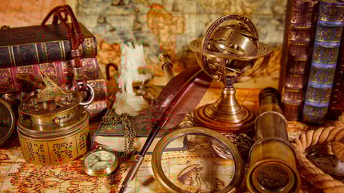 Vintage Navigation Equipment and Books on Antique Map